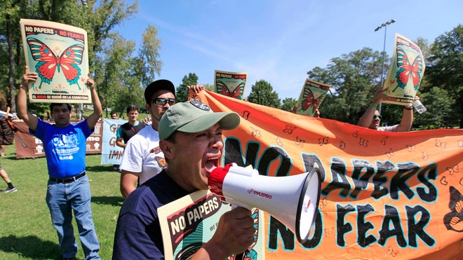 Democratic Convention Protesters Megaphone.jpg